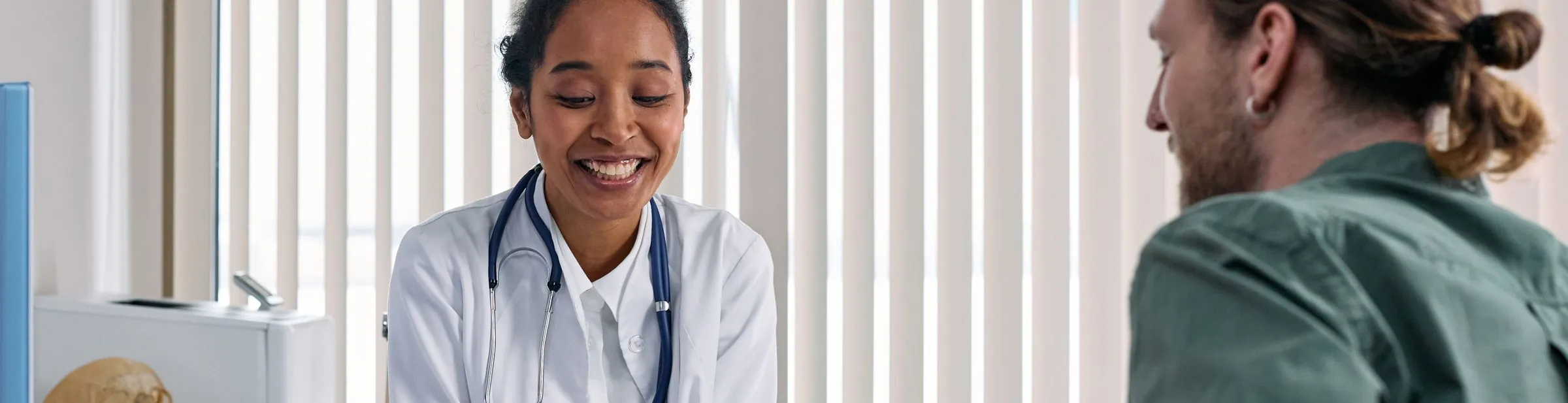 A doctor going over results on a tablet with a patient